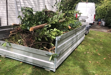 Opkuisen tuin en afvoeren groenafval